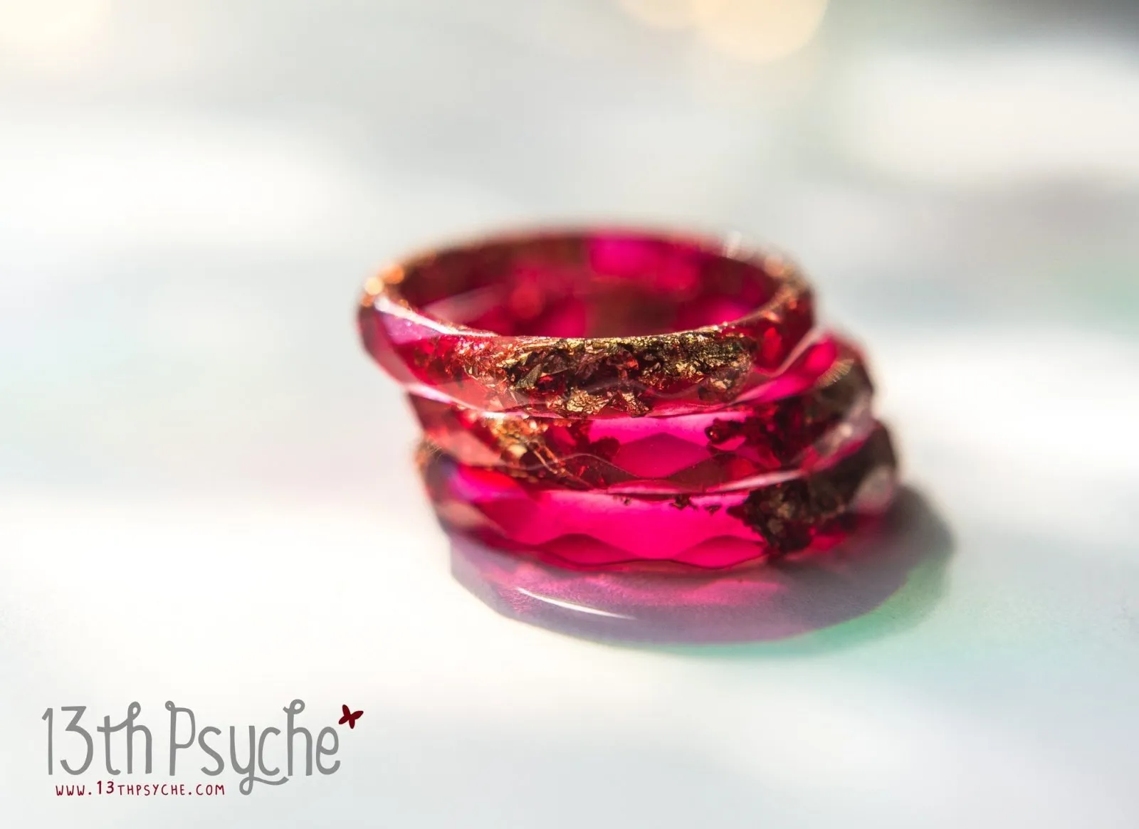 Dark red and gold flakes faceted resin ring